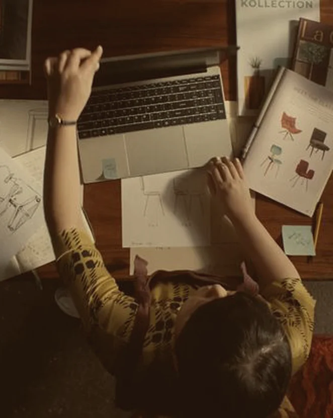 A creative director working through a brand story at her desk
